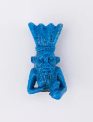 Bes, remounted as pin, c.1075-656 BC or later glazed faience